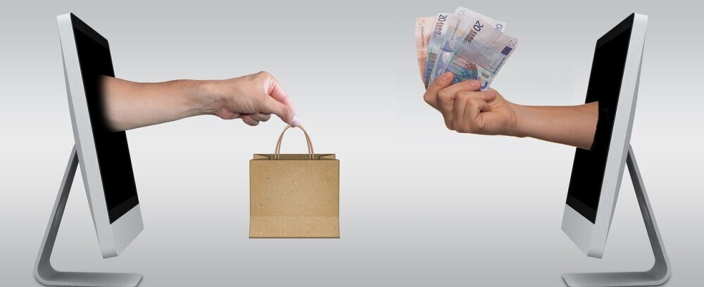 example of online sales - money and gift being exchanged through computers